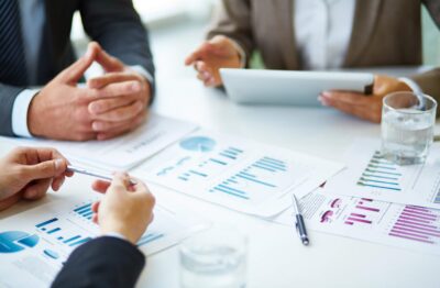 close-up-businesspeople-working-with-documents (1)