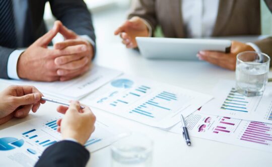 close-up-businesspeople-working-with-documents (1)